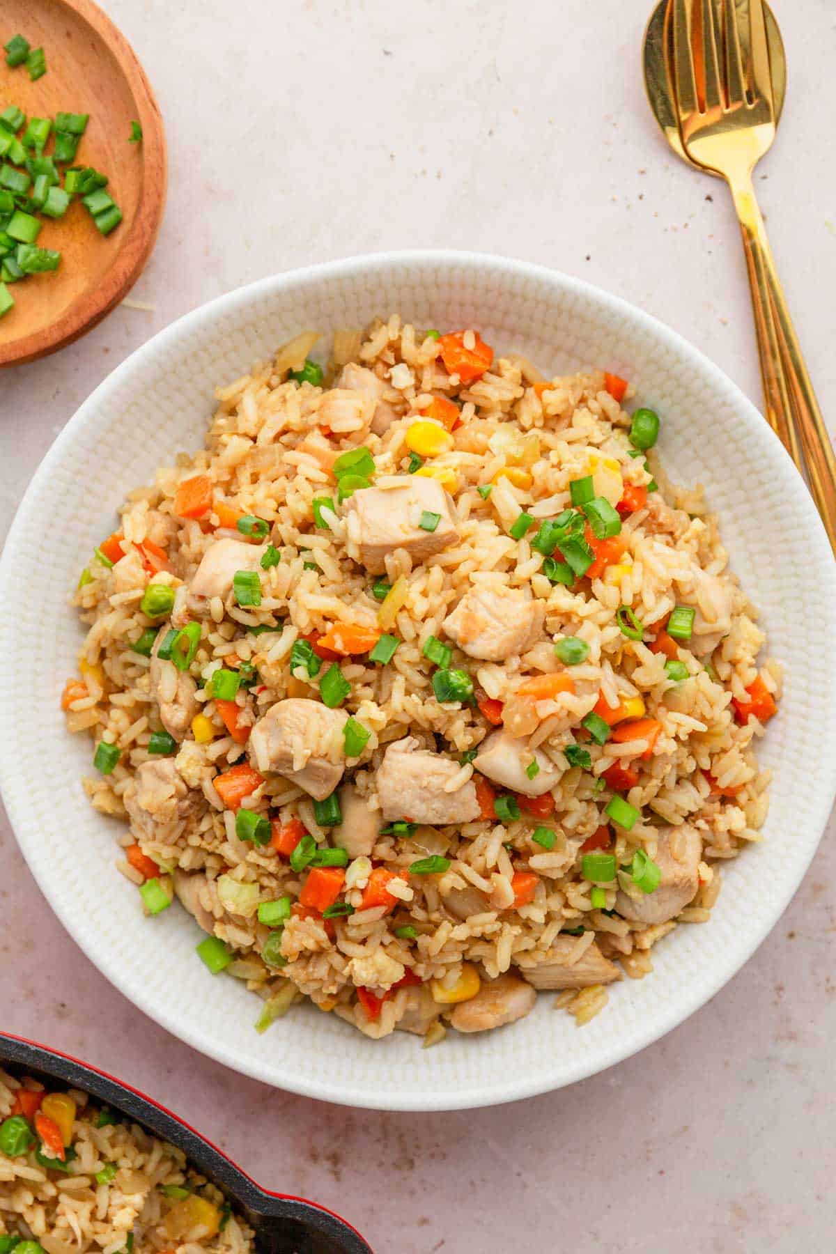 a bowl of chicken fried rice.