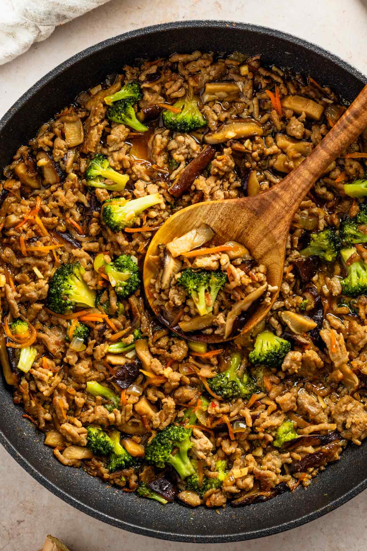 ground pork stir fry with broccoli, mushrooms and carrots.