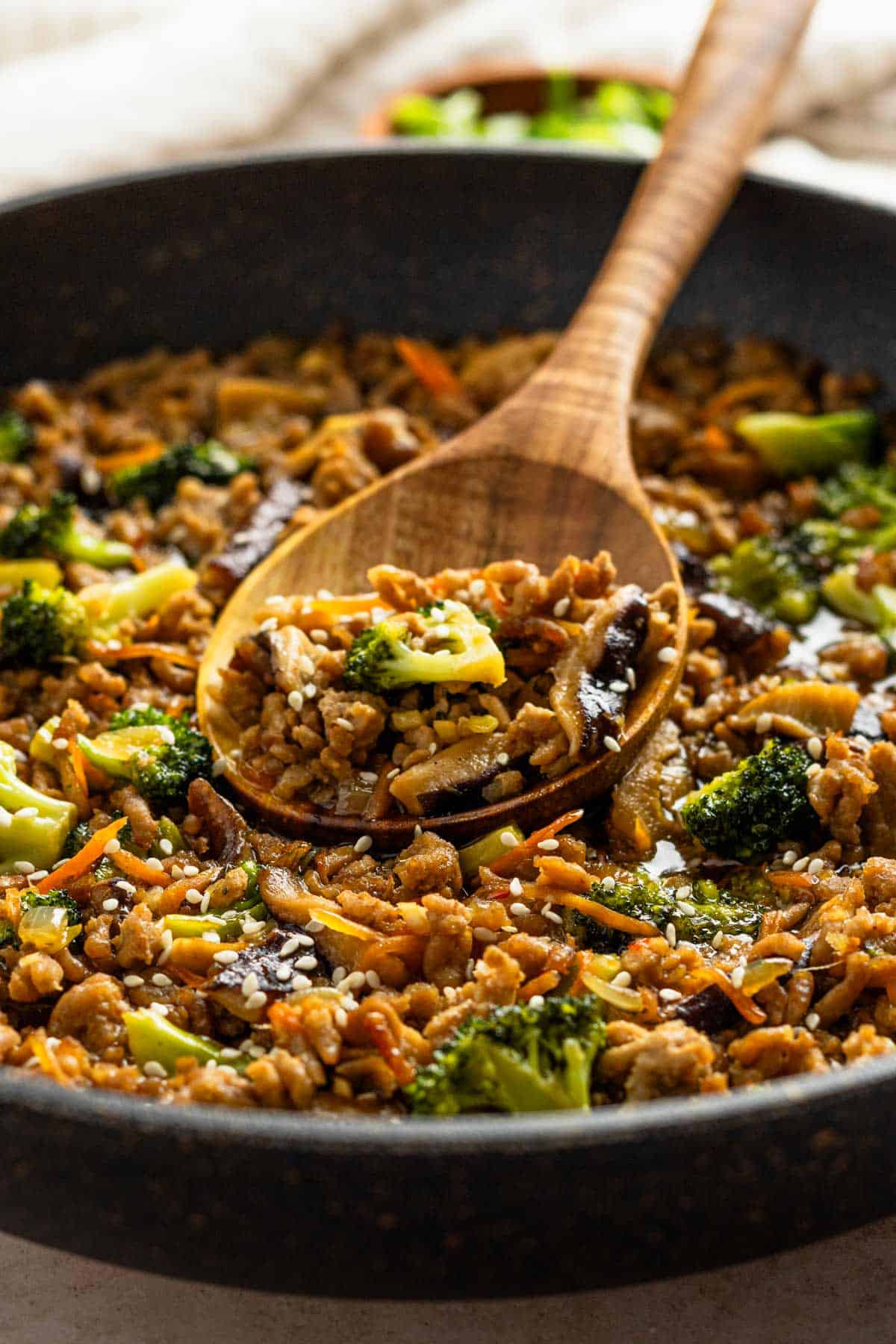 veggies and ground pork in skillet.