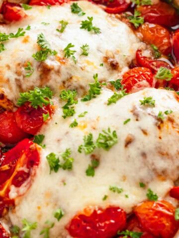 Easy baked chicken breast with mozzarella and cherry tomatoes.