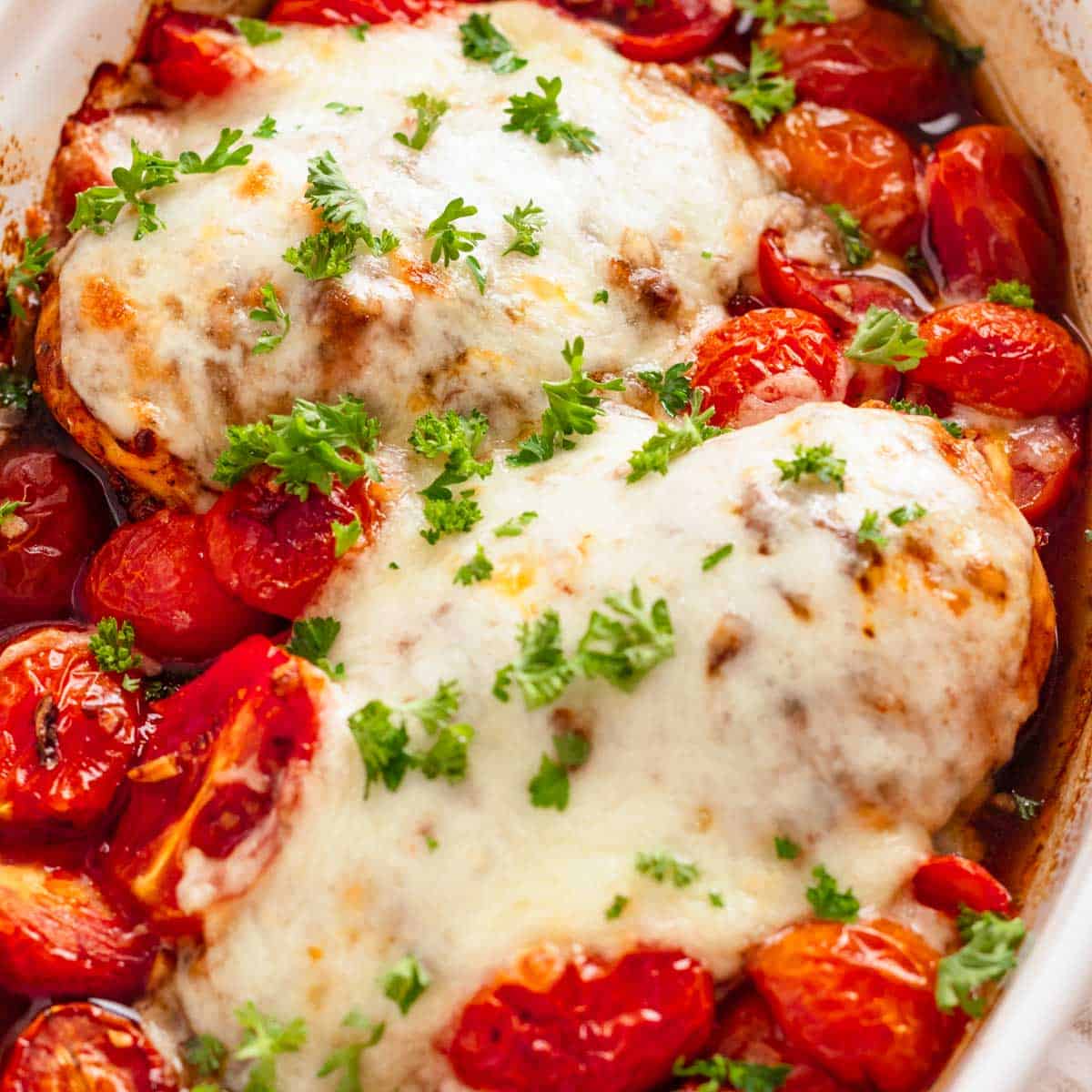 Easy baked chicken breast with mozzarella and cherry tomatoes.