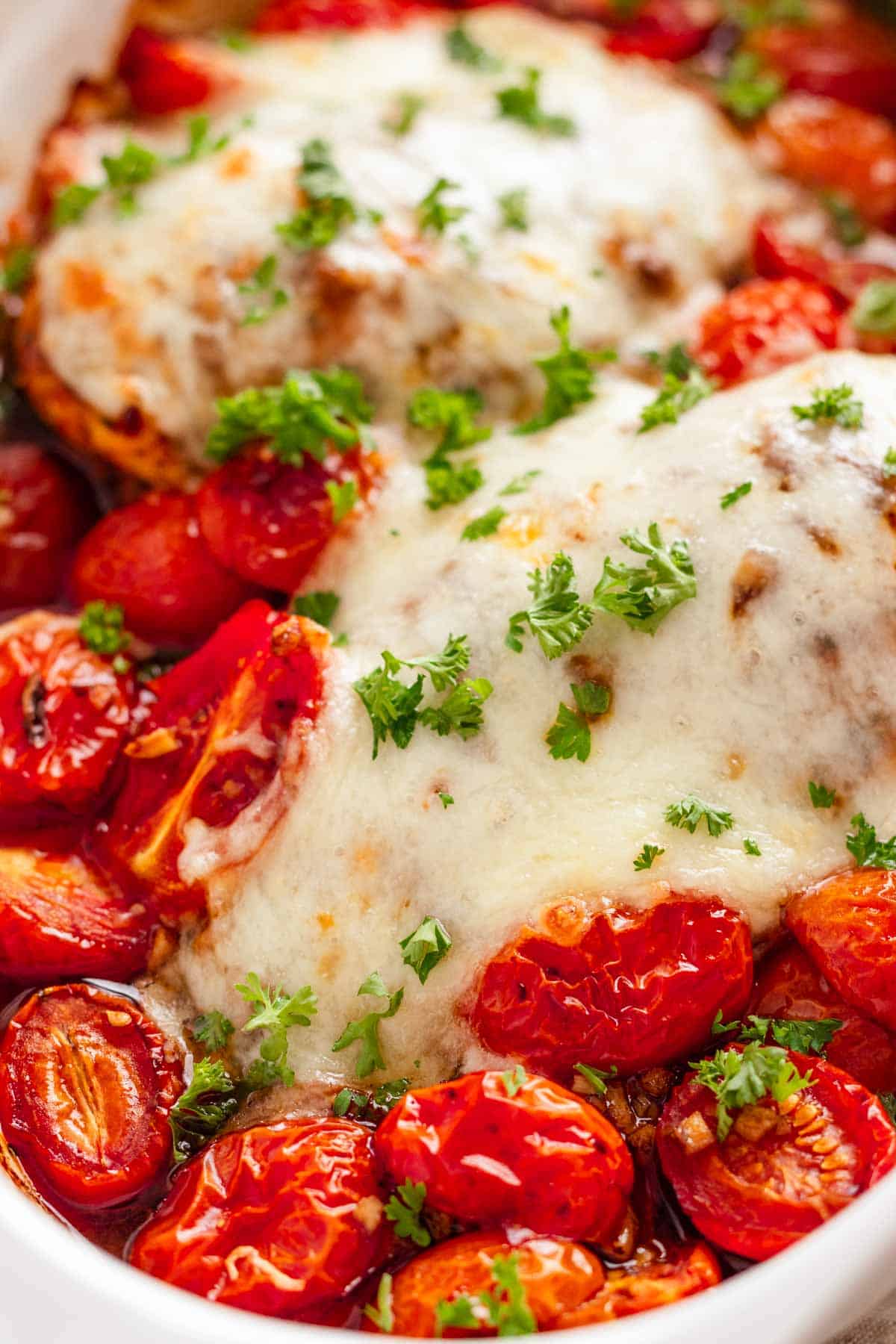 Easy baked chicken breast with mozzarella and cherry tomatoes.