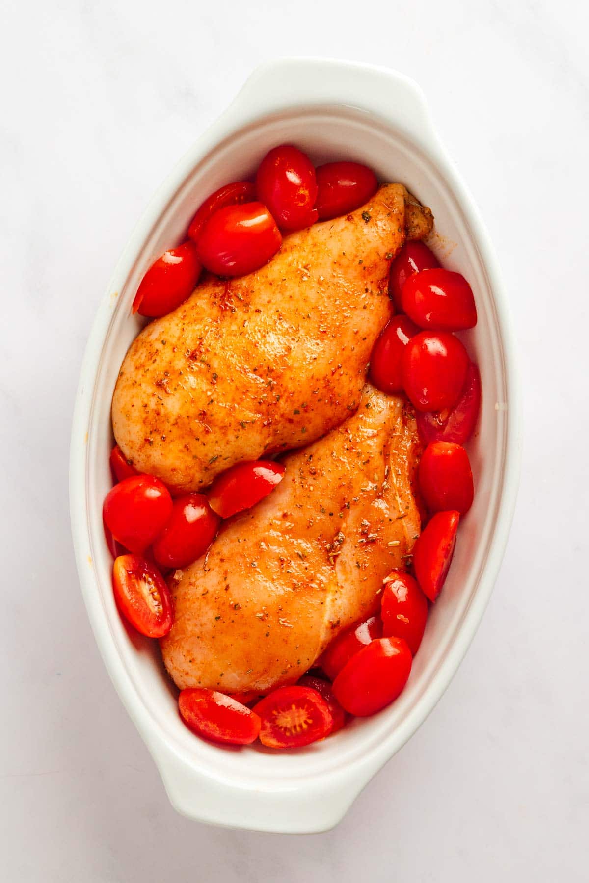 Easy baked chicken breast with mozzarella and cherry tomatoes.