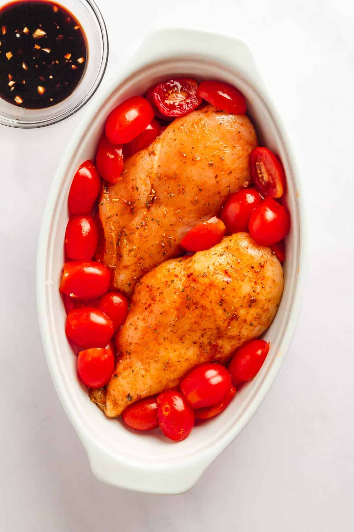 Easy baked chicken breast with mozzarella and cherry tomatoes.
