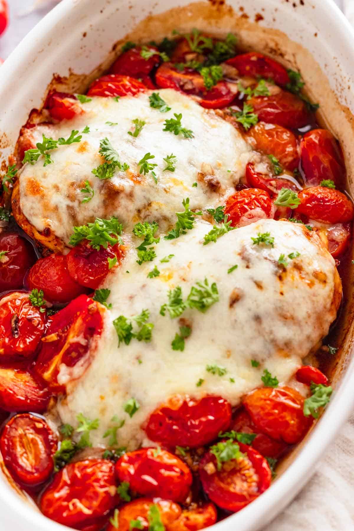 Easy baked chicken breast with mozzarella and cherry tomatoes.