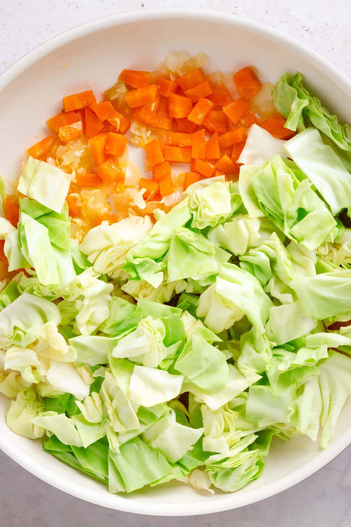 Sauteed veggies and freshly chopped cabbage.