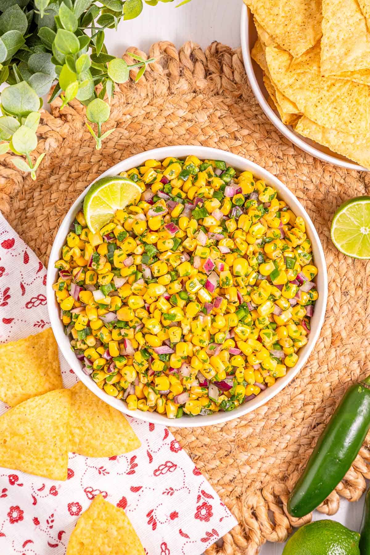 Bowl of Mexican corn salsa with sweet corn, red onion, cilantro, and lime.