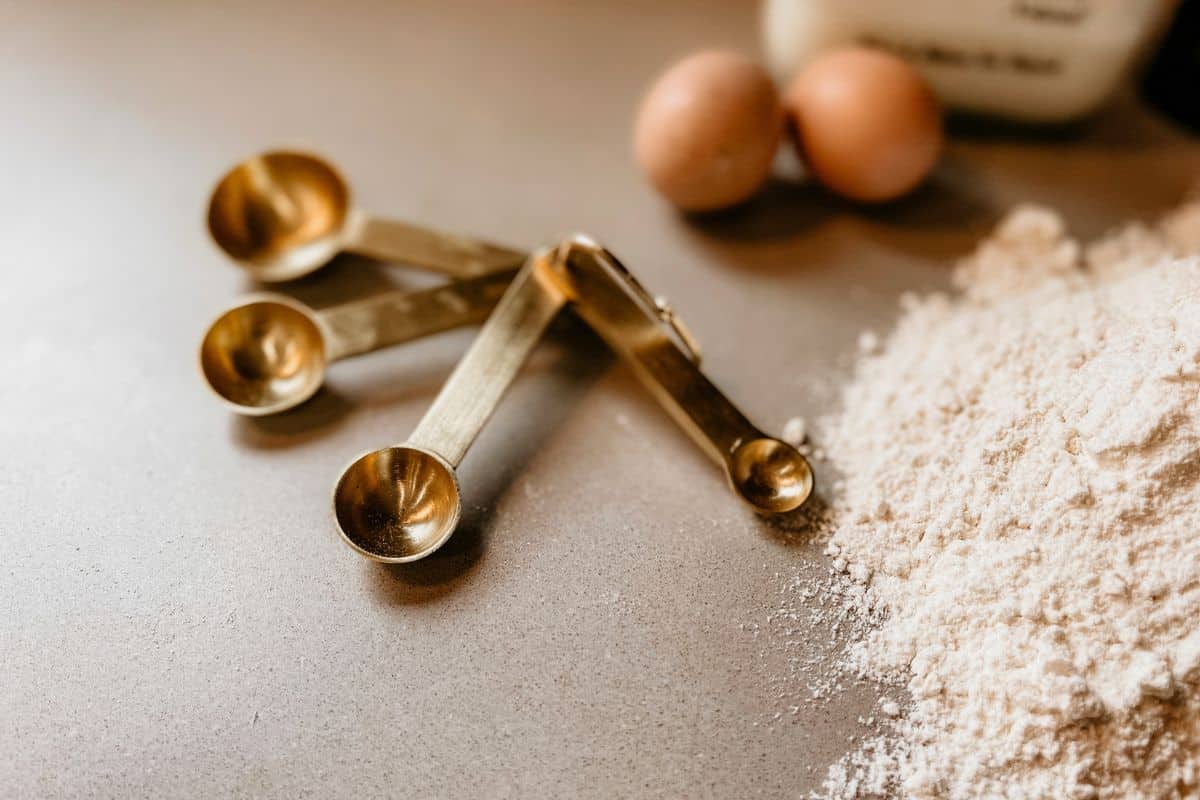 Measuring Spoons Beside Flour