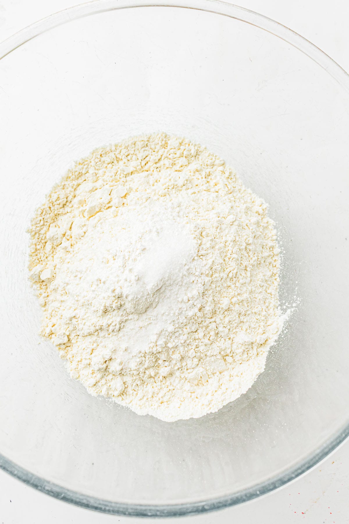 Flour mixture in a clear mixing bowl.