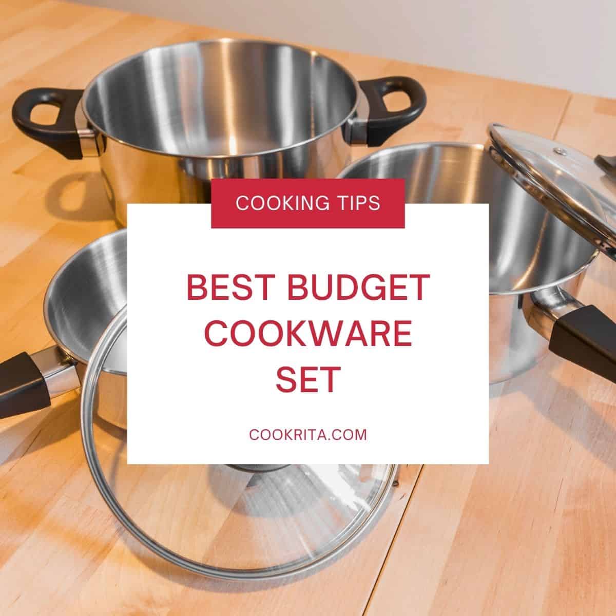 Stainless steel cookware set with pots and pans on a wooden kitchen counter