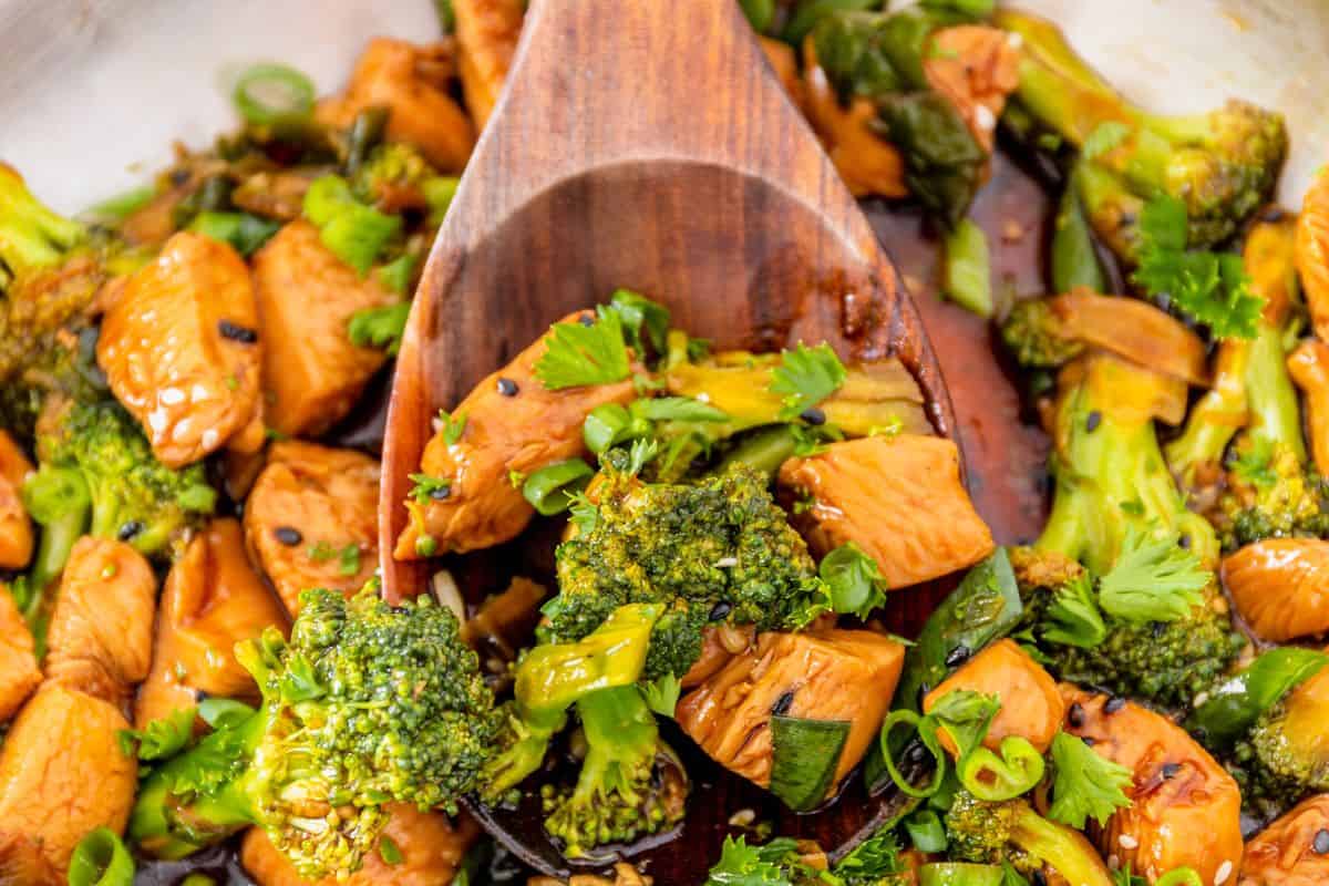 Chicken and broccoli stir-fry in savory sauce with green onions.