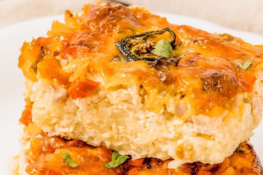 Baked cheesy chicken casserole with golden top and herbs