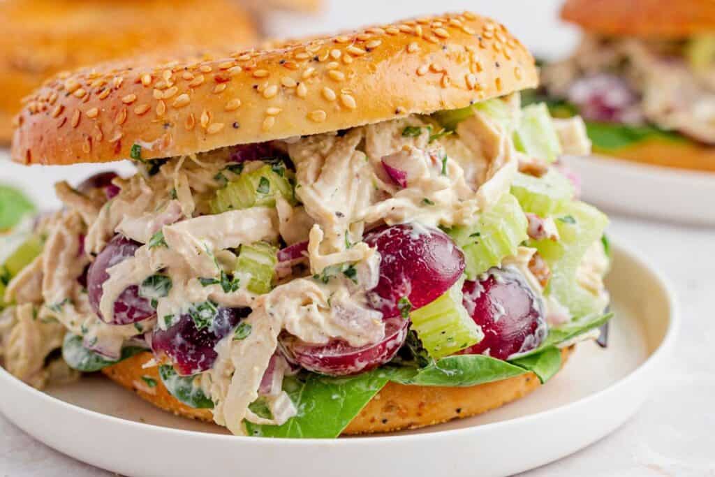 Chicken salad sandwich with lettuce on seeded bun