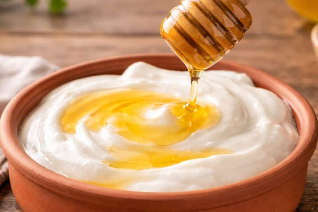 Bowl of yogurt with honey drizzle on top
