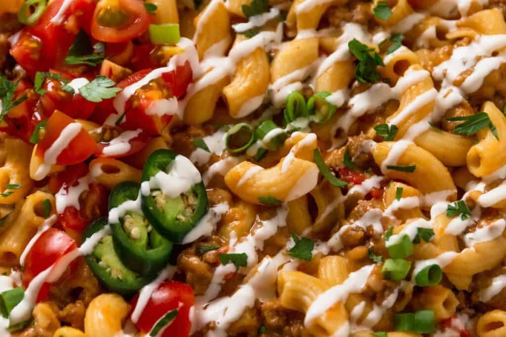 Pasta bake topped with cheese and fresh toppings