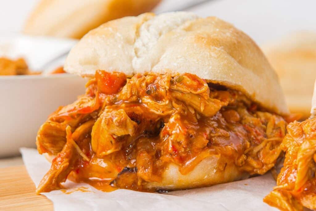 Pulled pork sandwich with shredded meat and sauce