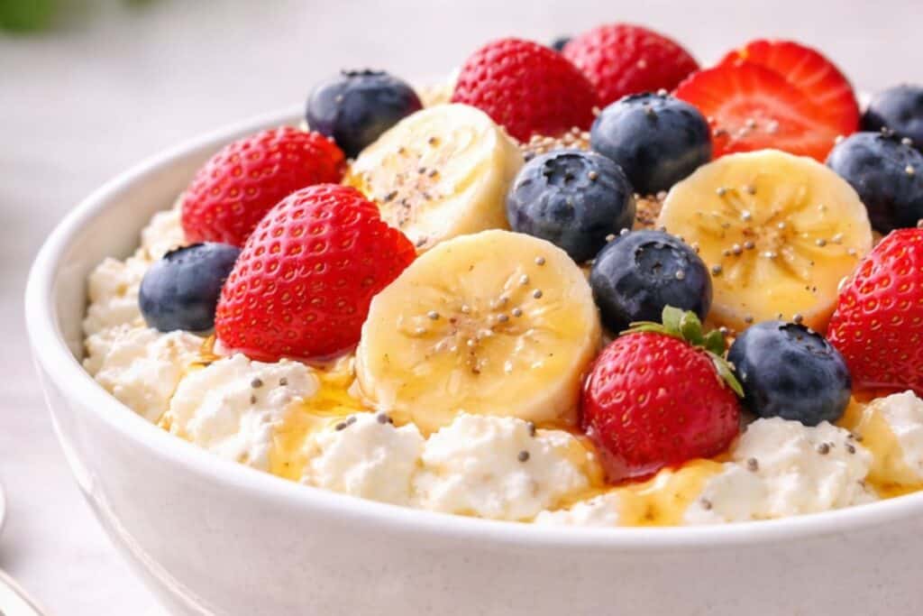 Cottage cheese topped with banana and berries