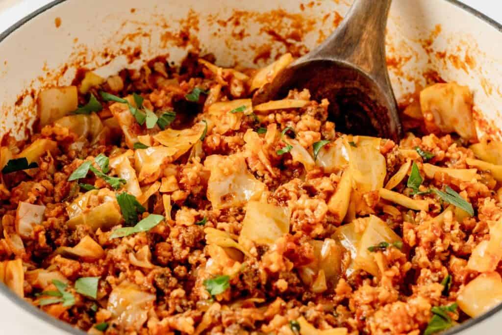 Ukrainian lazy cabbage rolls with herbs in a skillet