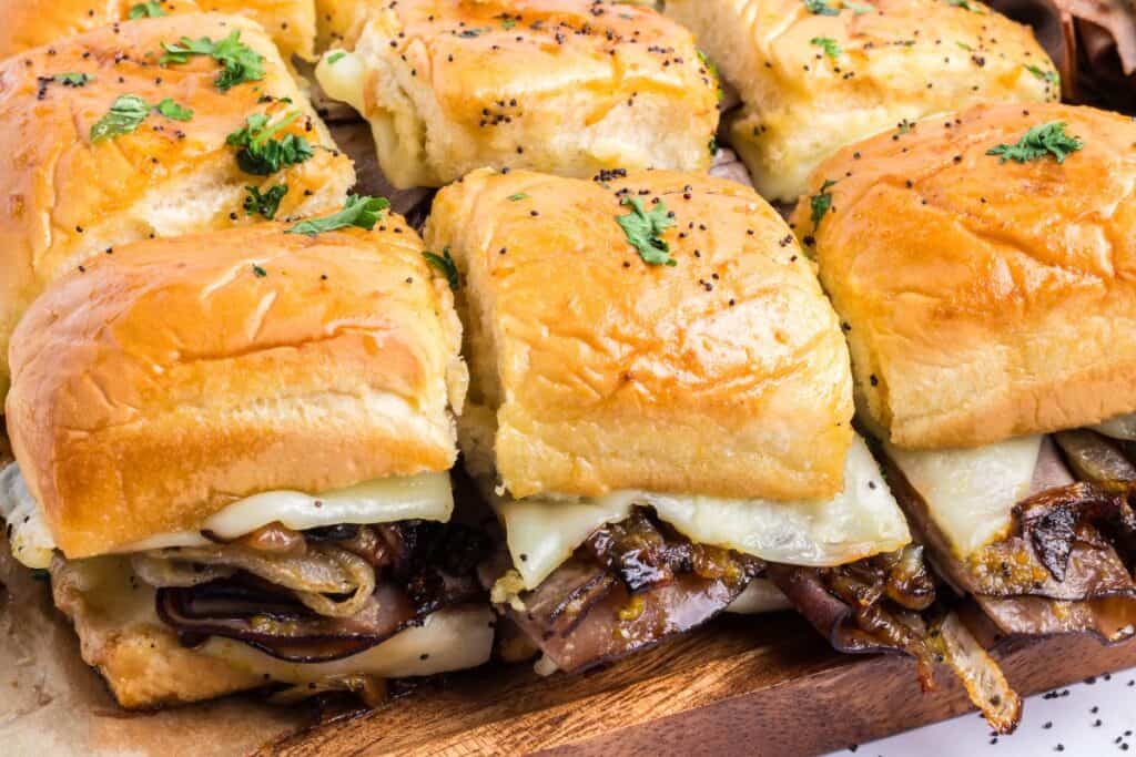 Roast beef sliders with melted cheese on soft buns