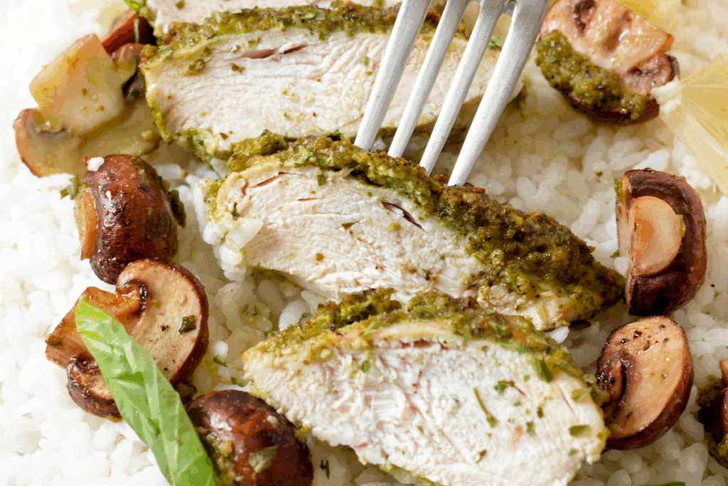 Baked pesto chicken with herbs and roasted vegetables