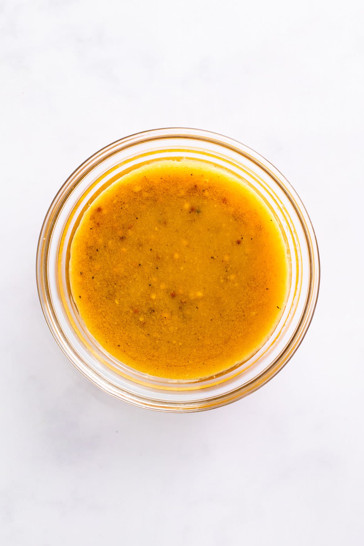 Creamy miso mustard dressing in a small glass bowl
