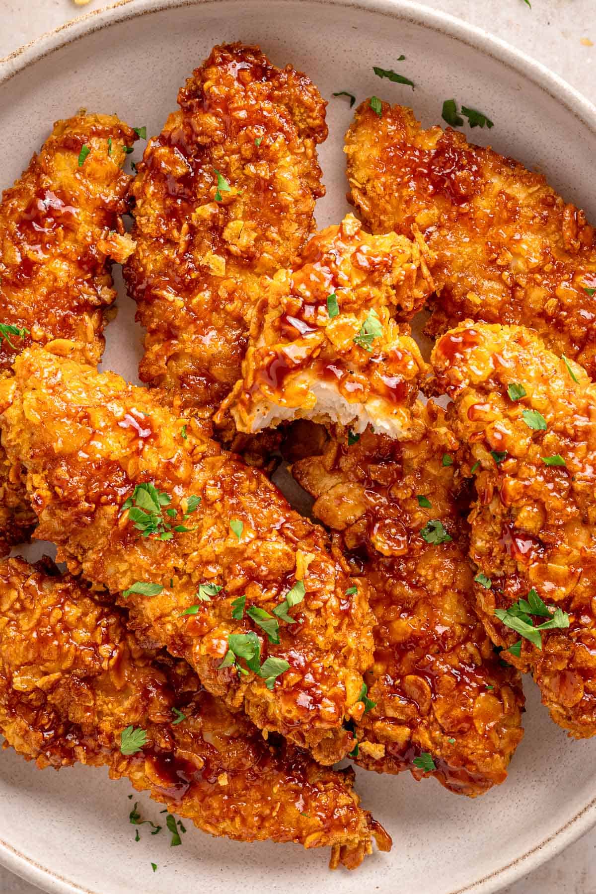 Crispy cornflake chicken tenders coated with barbecue sauce
