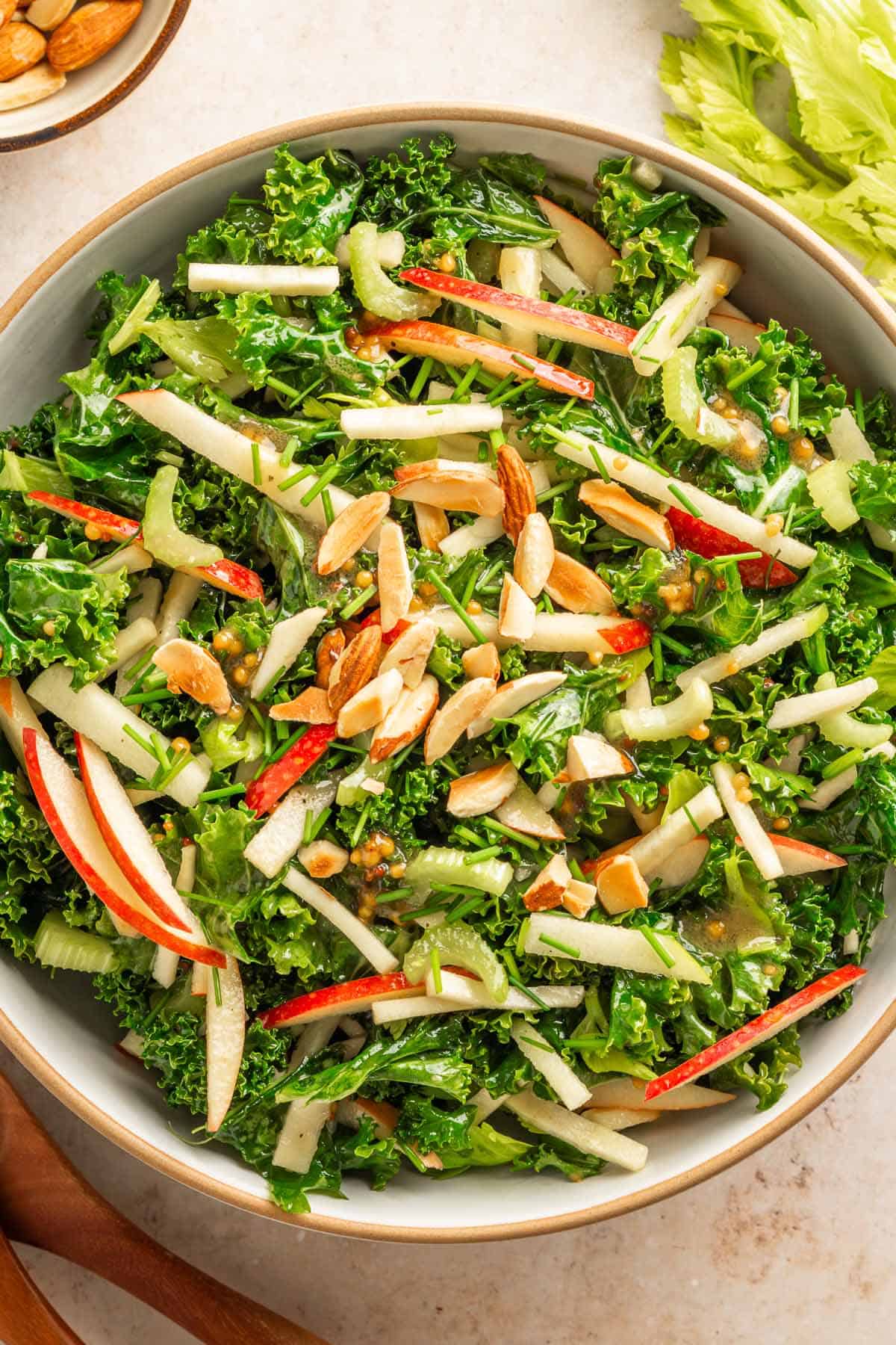 Fall kale salad with apples, celery, chives, and toasted almonds