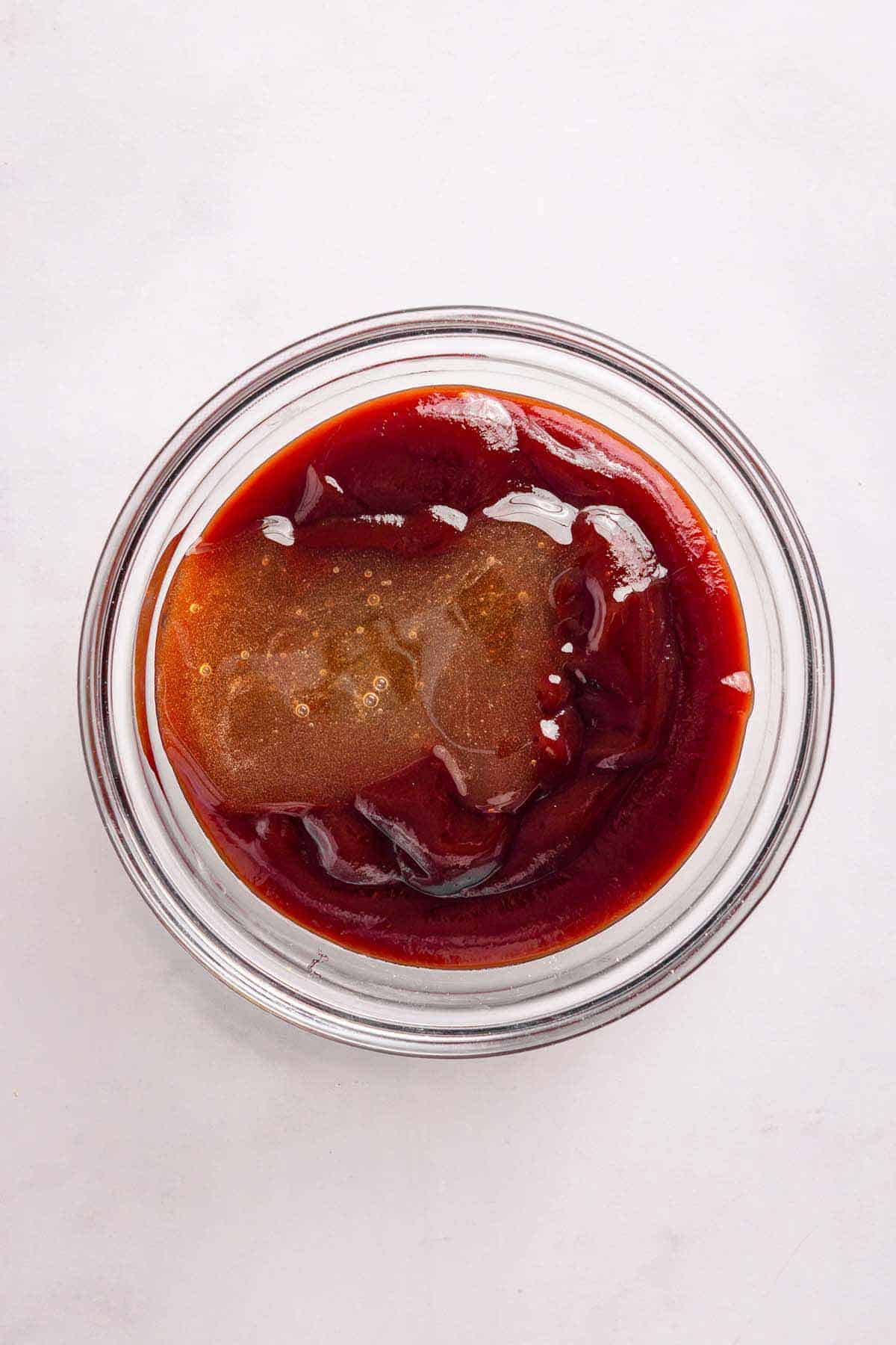 Barbecue sauce ingredients mixed in a small glass bowl