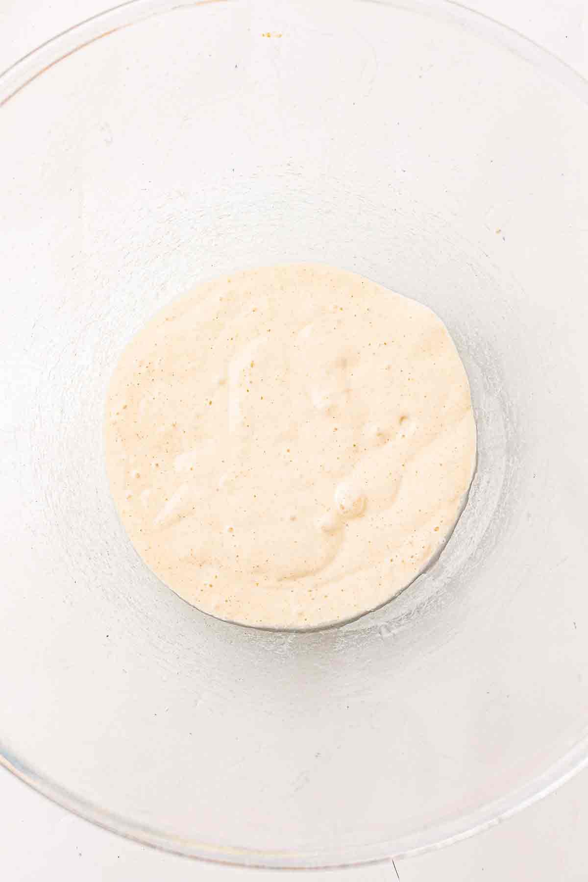 Sourdough discard in a clear mixing bowl