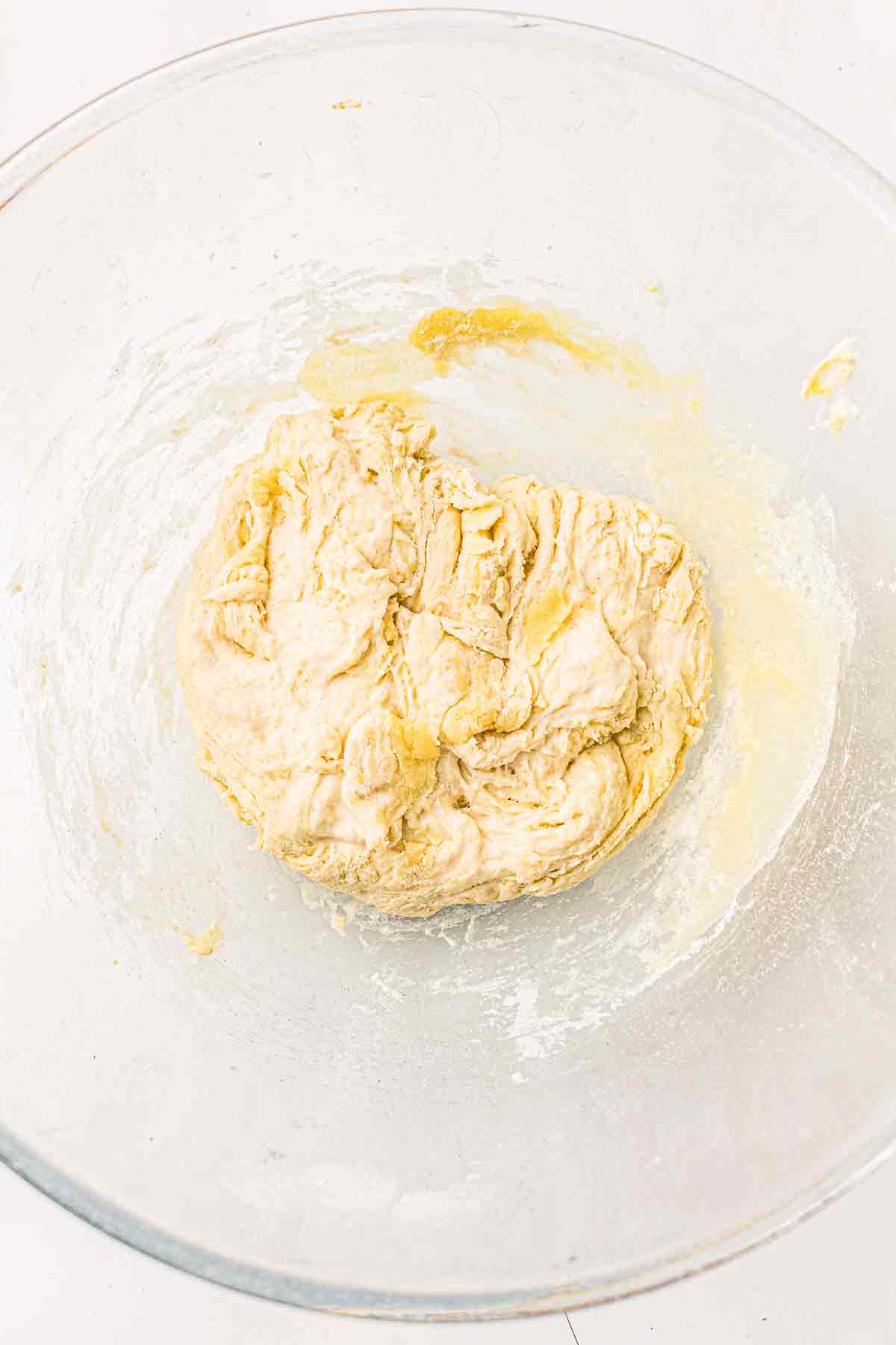 Sourdough cracker dough mixed in a glass bowl