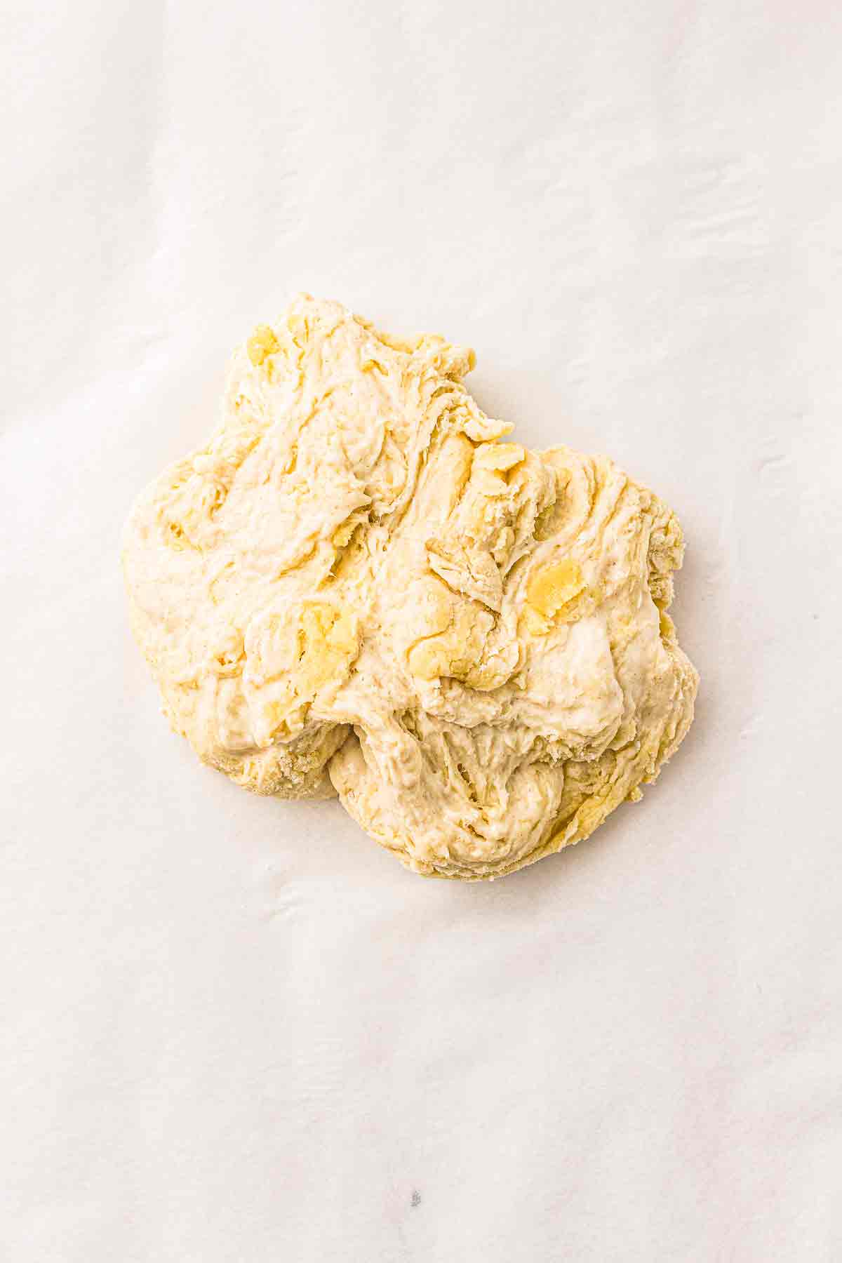 Sourdough cracker dough placed on parchment paper