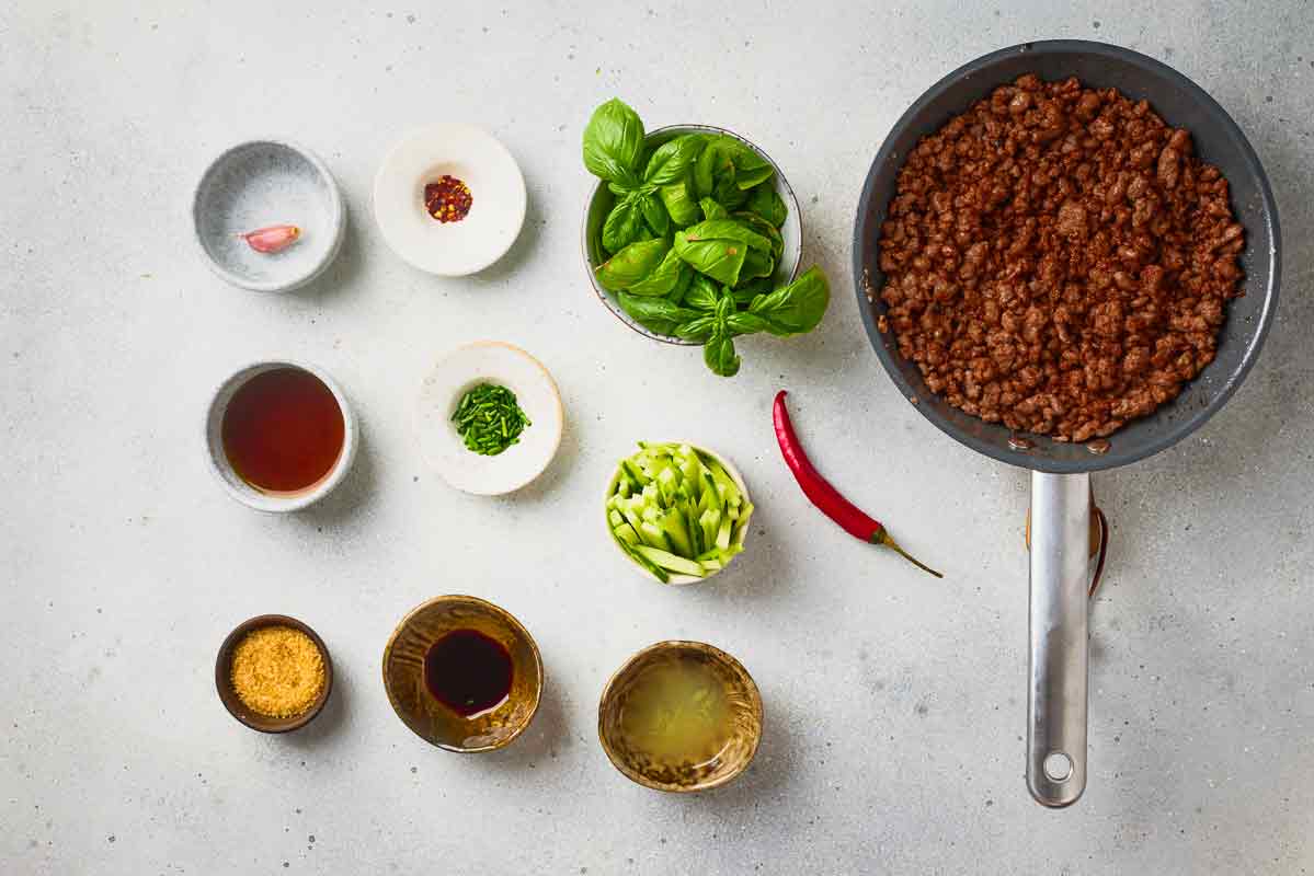Ground beef cooked and browned in a skillet for the spring roll filling