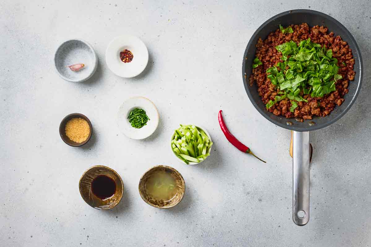 Fresh Thai basil added to the cooked ground beef filling.