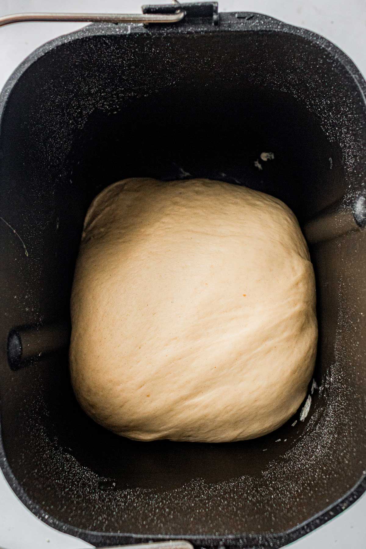 Smooth bread dough after the bread machine dough cycle is complete.