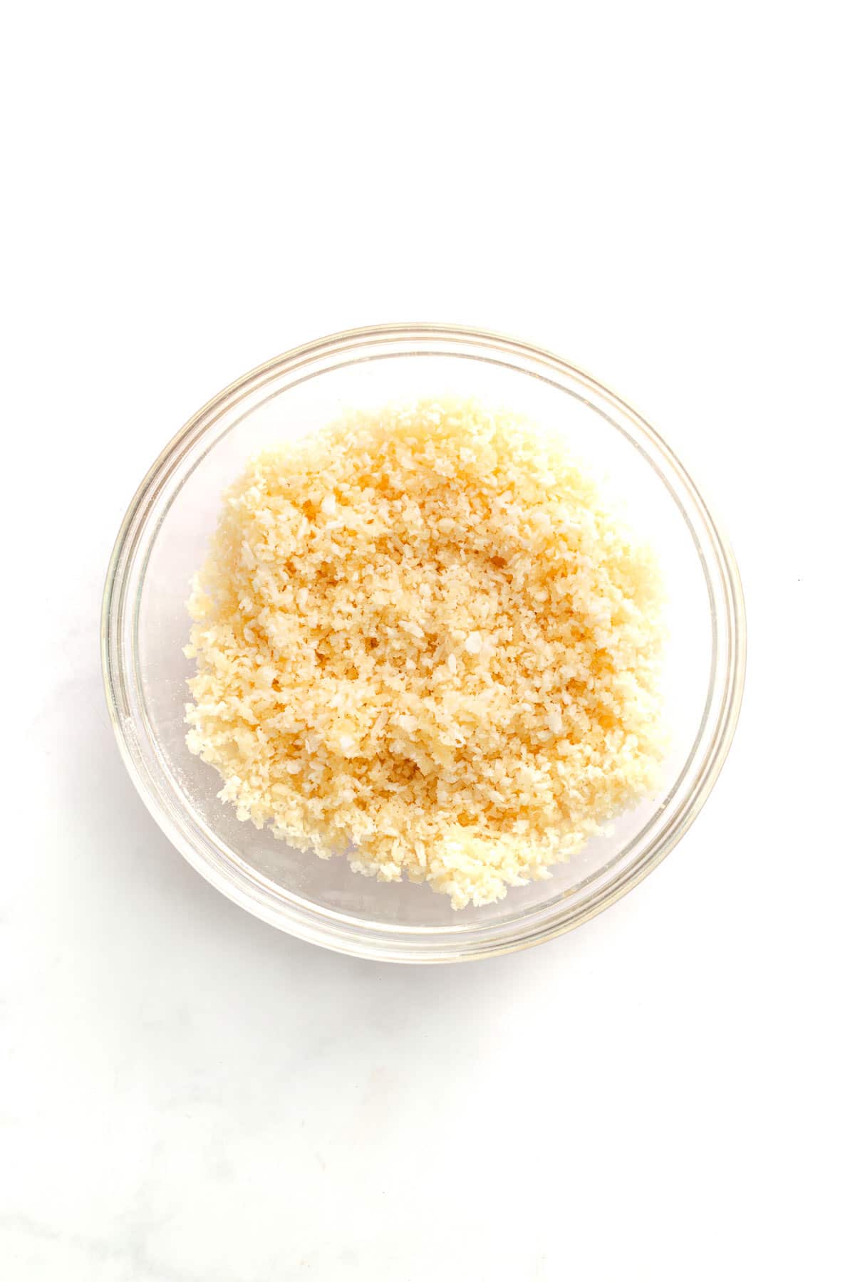 Panko breadcrumb topping mixed with Parmesan in a small glass bowl