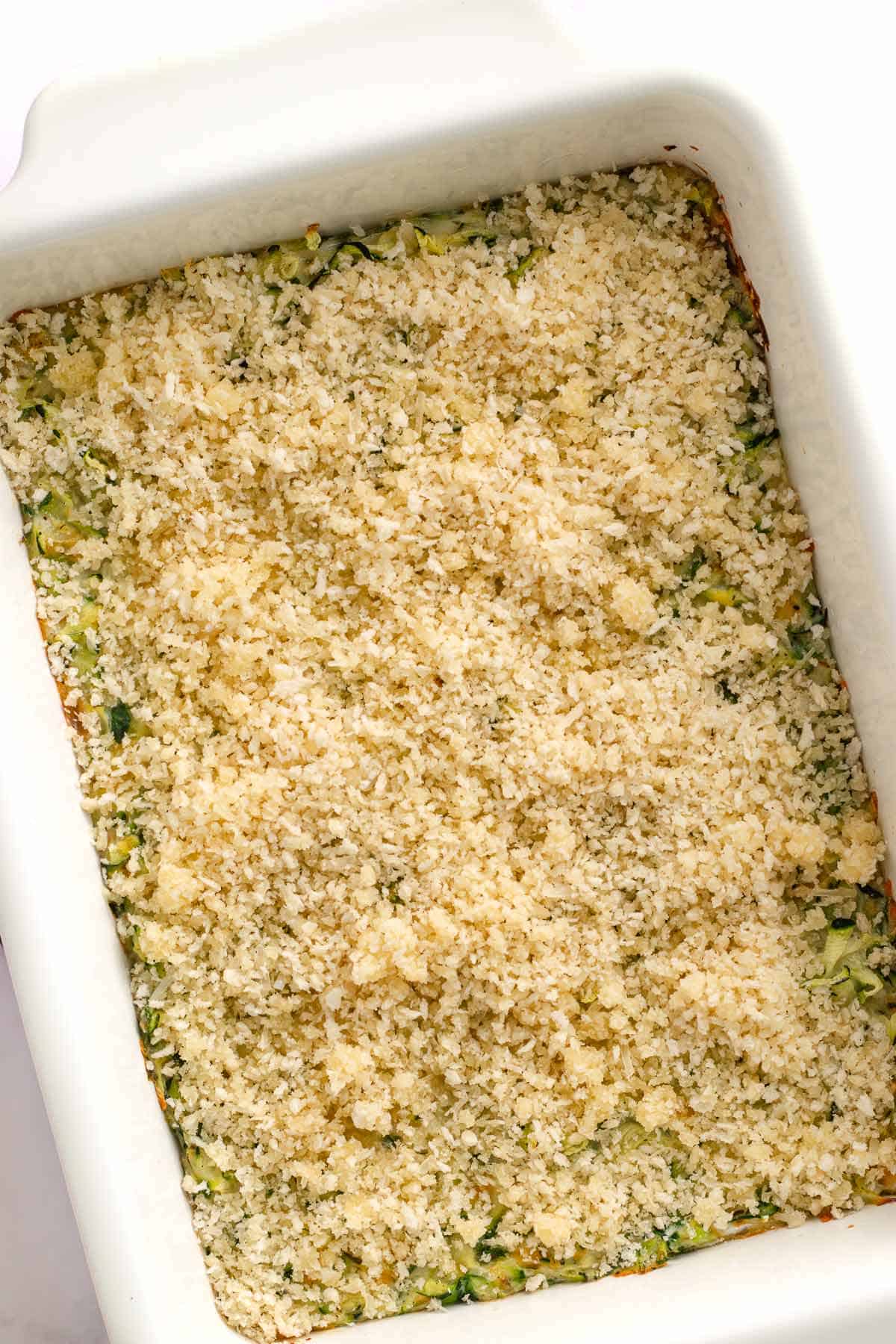 Cheesy zucchini casserole with a golden breadcrumb topping fresh from the oven