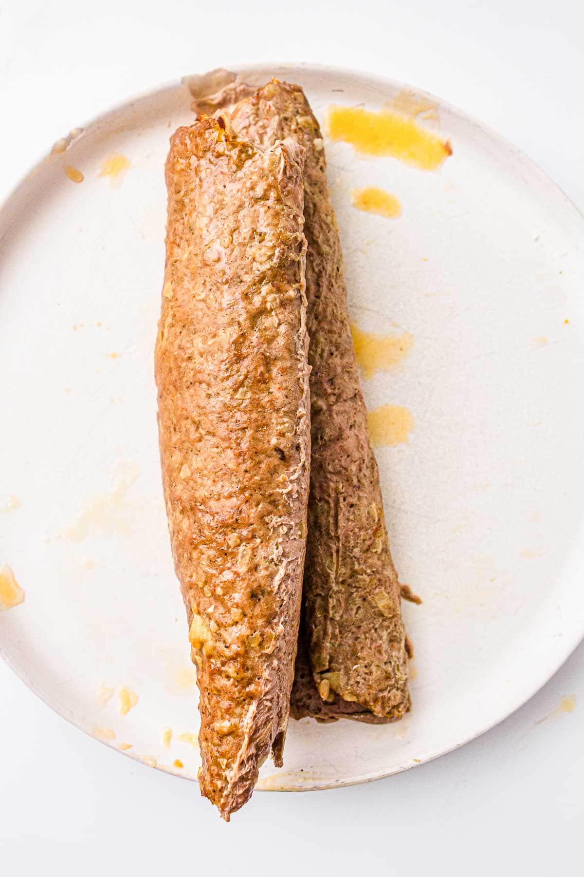 Baked kebab meat log cooked until lightly browned