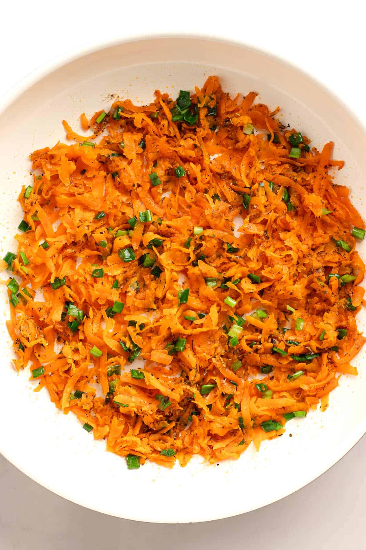 Cooked sweet potato mixture with green onions and seasonings