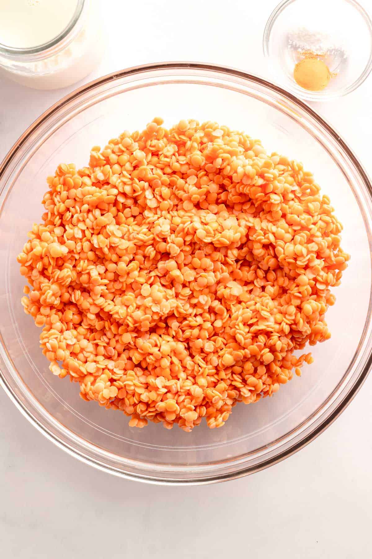 Soaked red lentils in a glass bowl