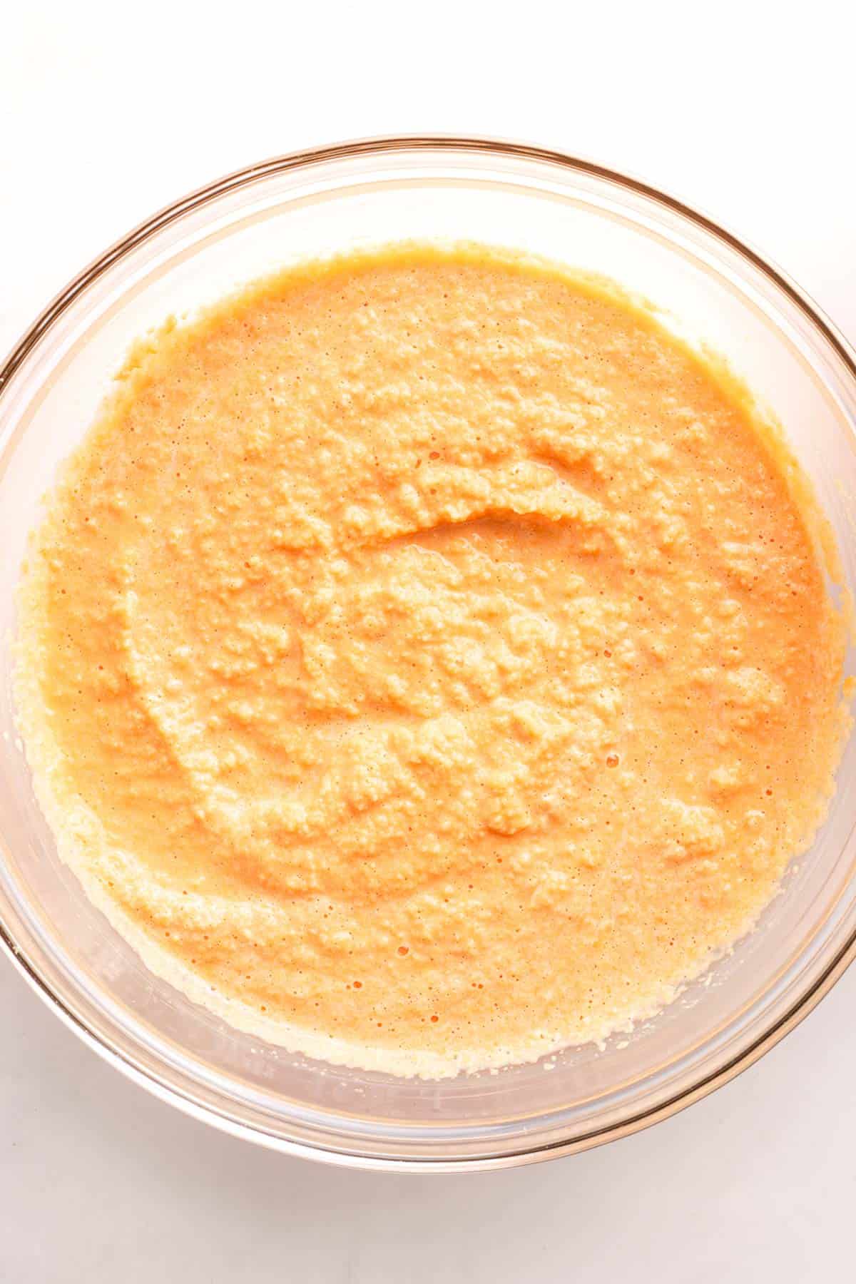 Blended red lentil batter in a glass bowl
