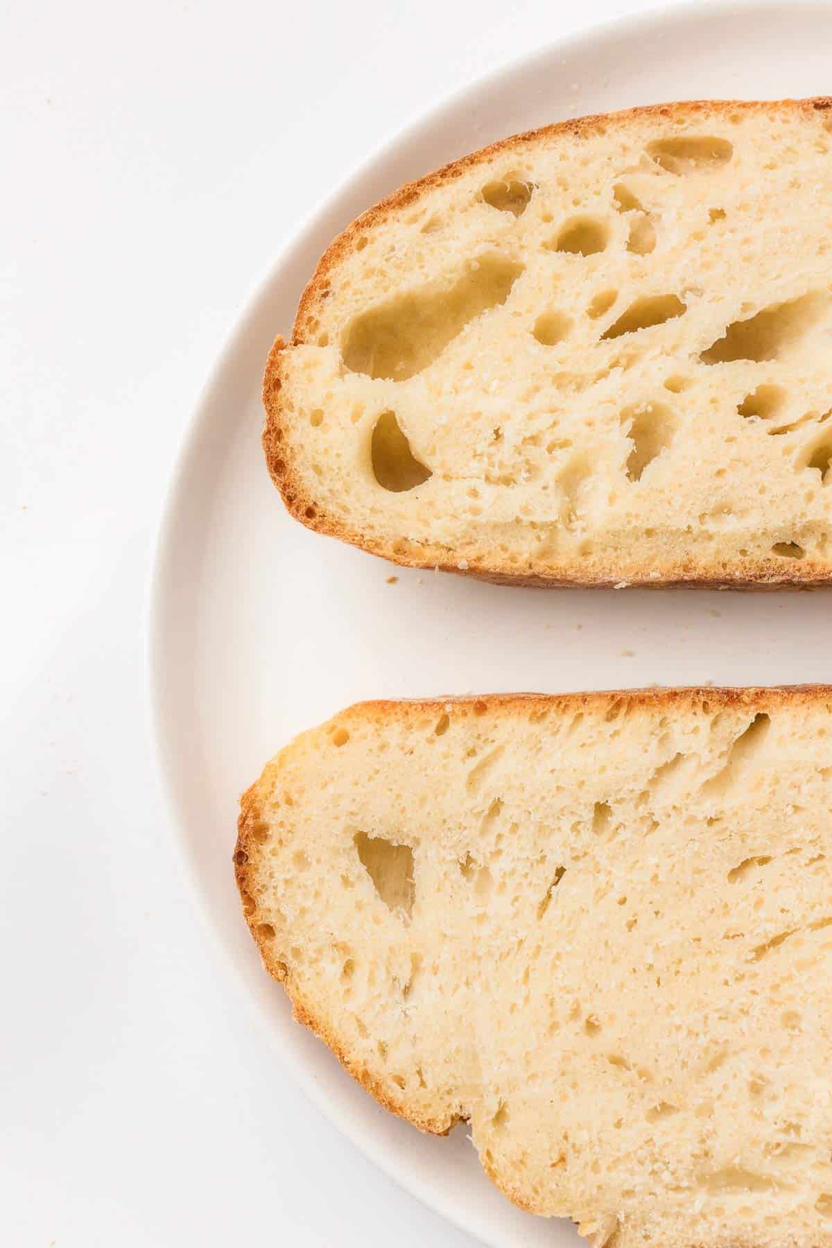 Close-up of sliced sourdough bread showing an airy crumb
