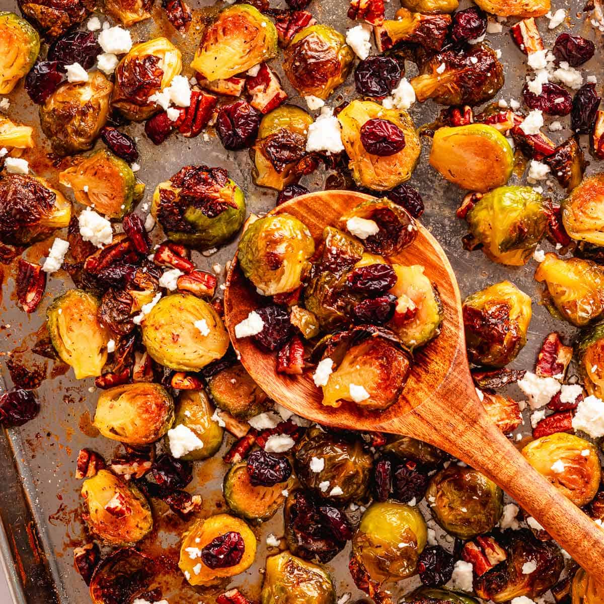 Maple pecan Brussels sprouts with dried cranberries and crumbled feta on a serving platter